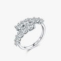 Moissanite cluster band in sterling silver with crossover design - front view
