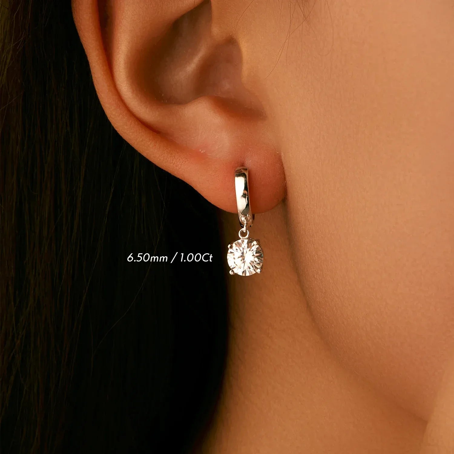 White moissanite floating huggie earrings in 925 sterling silver - pair view